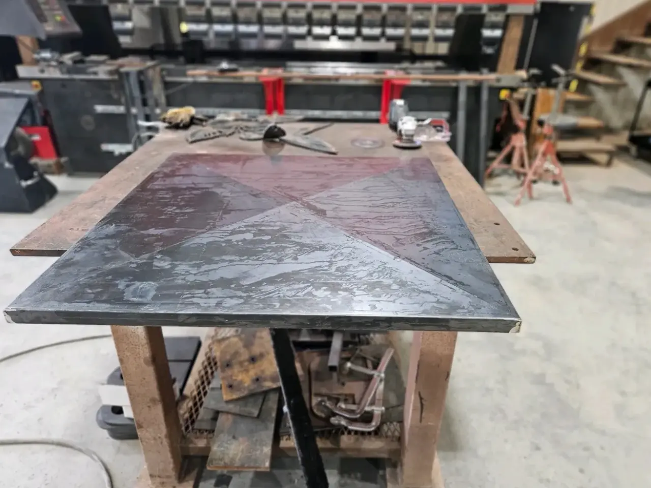 8.webp A table with metal top and wooden base.